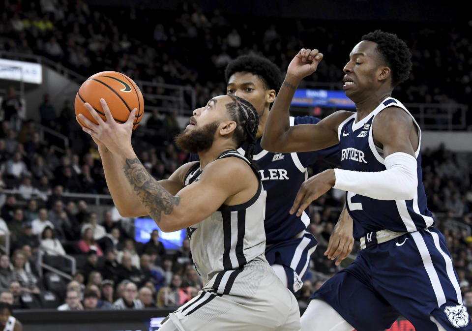 Providence's Jared Bynum (4) eyes the net for two points during the first half of an NCAA college basketball game against Butler, Wednesday, Jan. 25, 2023, in Providence, R.I. (AP Photo/Mark Stockwell)