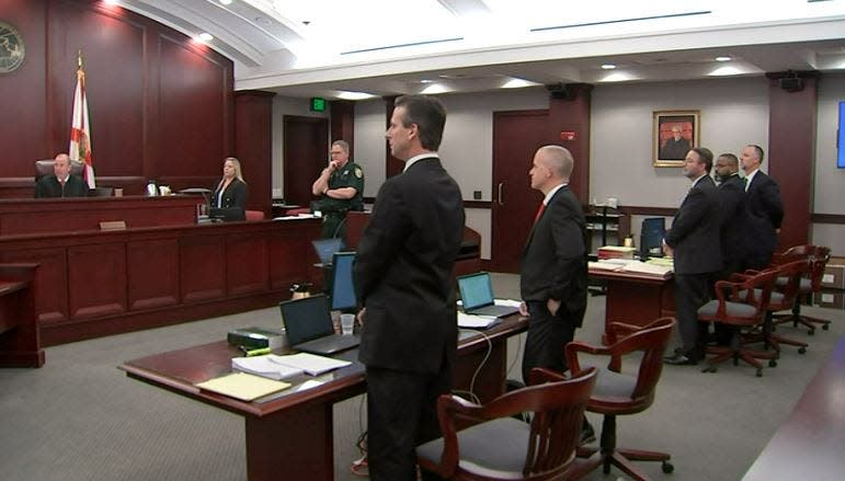 Circuit Judge R. Lee Smith (left) welcomes the jury back to the courtroom Thursday morning after the prosecution (center) and defense (right) rest in the trial against former Clay County Sheriff Darryl Daniels (second from right).