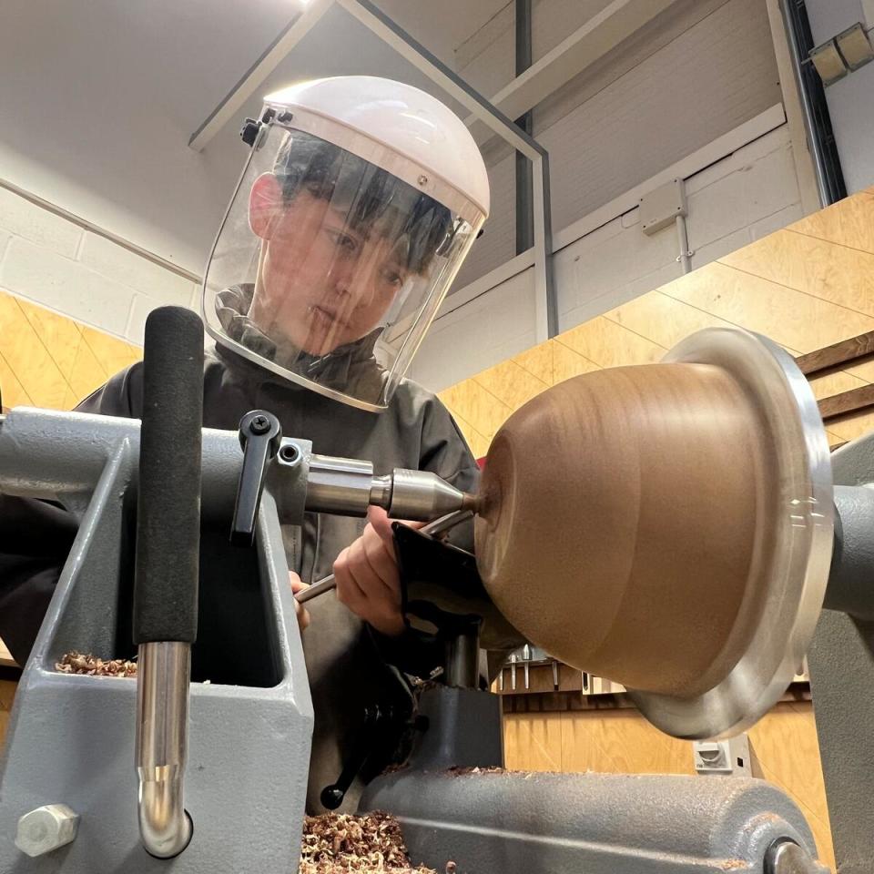 Boy looking at a bowl 