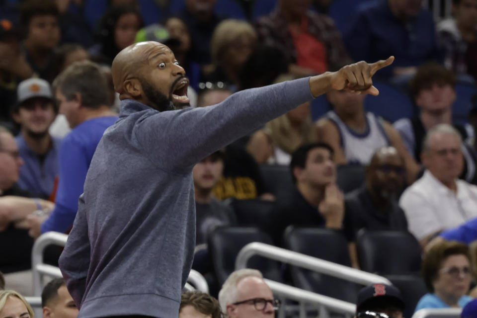 Orlando Magic head coach Jamahl Mosley yells to his team during the first half of an NBA basketball game against the Philadelphia 76ers Friday, Nov. 25, 2022, in Orlando, Fla. (AP Photo/Kevin Kolczynski)