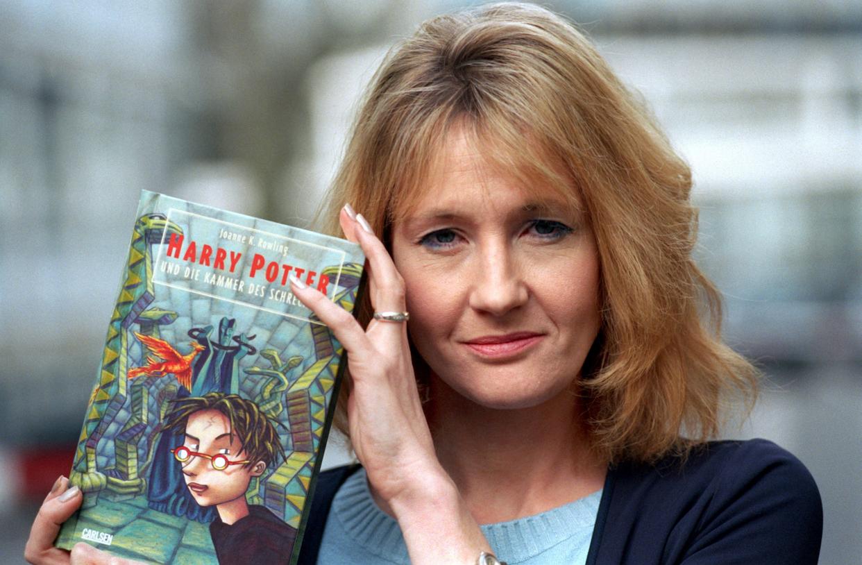 JK Rowling holding a Harry Potter book. (Getty Images)