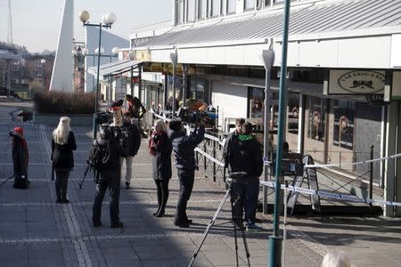 FILE PHOTO: Members of the media work at the scene of a fatal shooting in Gothenburg, Sweden March 18, 2015. Several people were killed in the restaurant shooting in the Swedish city of Gothenburg on Wednesday in what police say was likely to be a gang-related shooting. REUTERS/Adam Ihse/TT News Agency/File Photo