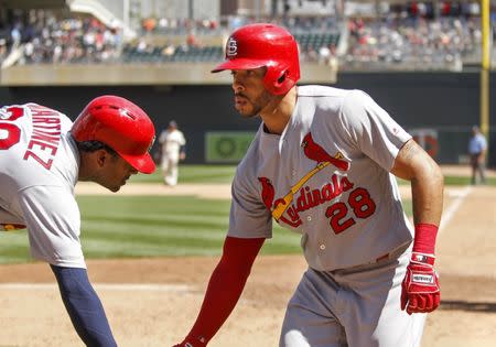 May 16, 2018; Minneapolis, MN, USA; St. Louis Cardinals center fielder Tommy Pham (28) celebrates his solo home run with designated hitter Jose Martinez (38) against the Minnesota Twins in the eighth inning at Target Field. Mandatory Credit: Bruce Kluckhohn-USA TODAY Sports