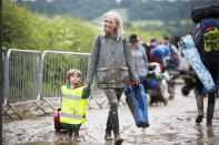 Mum and son: A young boy gets his first taste of Glastonbury. (SWNS)