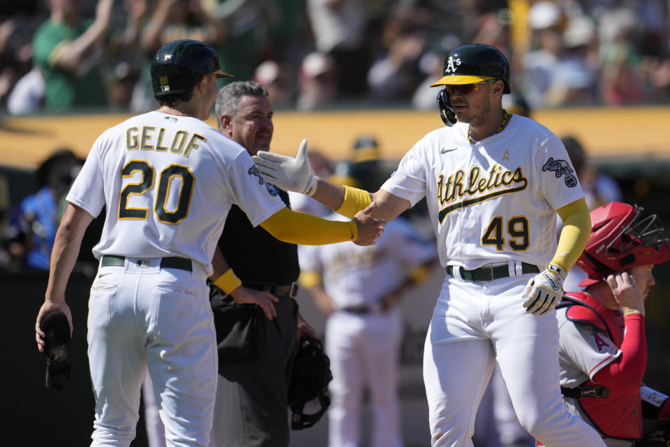 Oakland Athletics' Ryan Noda (49) celebrates after hitting a two-run home run that also scored Zack Gelof (20) during the sixth inning of a baseball game against the Los Angeles Angels in Oakland, Calif., Sunday, Sept. 3, 2023. (AP Photo/Jeff Chiu)