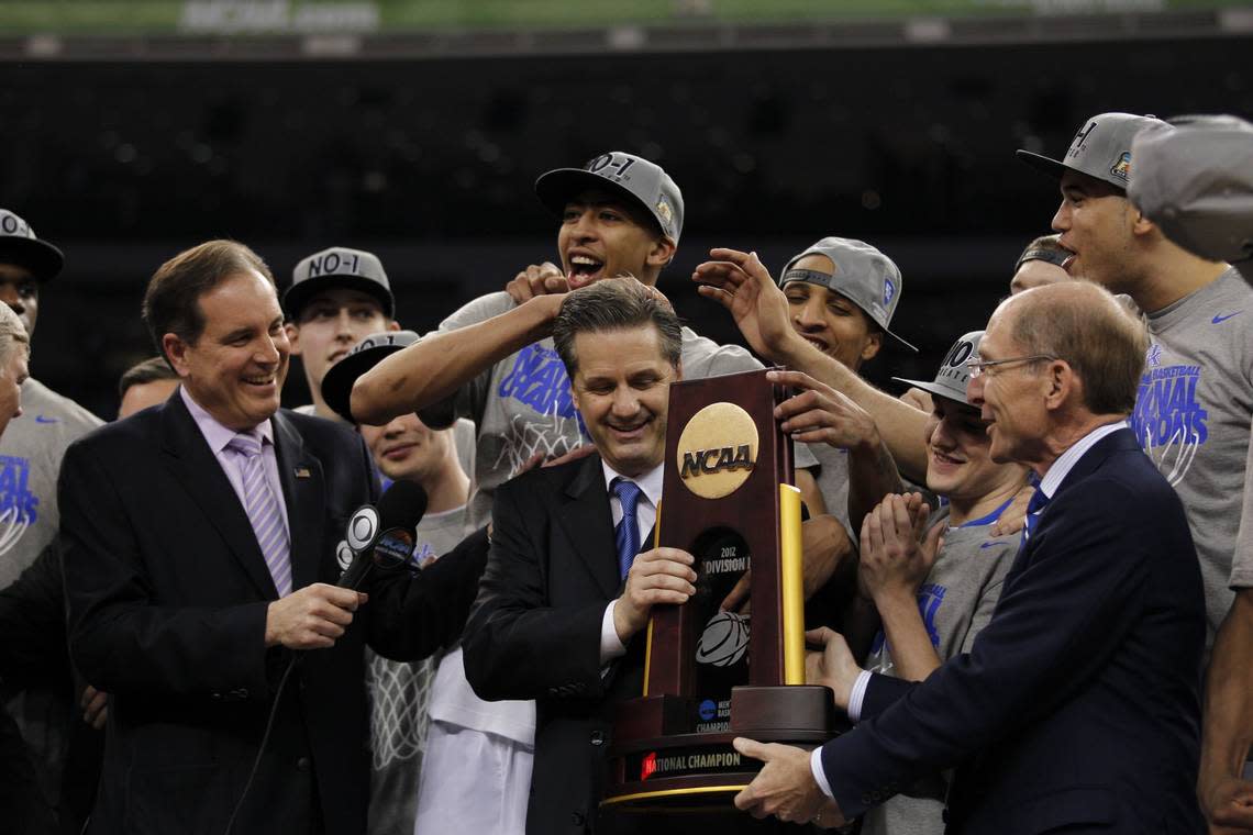 John Calipari and the Kentucky Wildcats receive the NCAA championship trophy after winning the 2012 title. Charles Bertram/Herald-Leader file photo