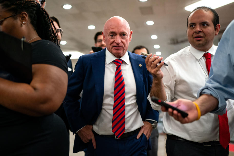 Senator Mark Kelly (D-AZ) speaks with reporters while waiting to catch the Senate subway on July 25, 2024 (Getty Images)