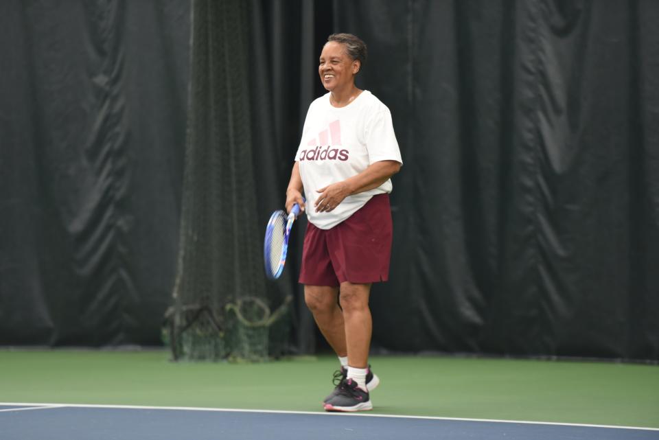 Michele Winfield is seen during the 66th Francis J. Robinson Memorial Tournament at the Port Huron Tennis House on Thursday. The longtime tennis instructor teamed up with her niece and former student, Brittany Banks, to play women's doubles in the tournament.