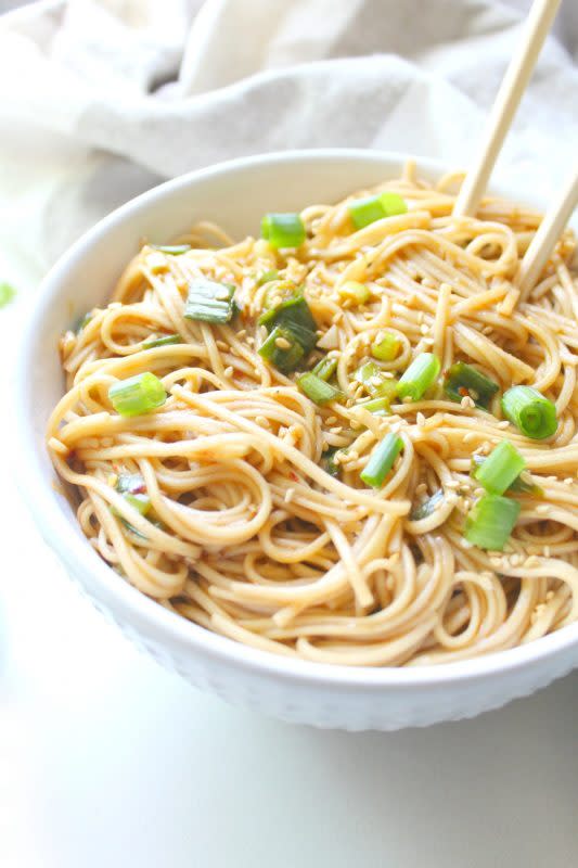 <p>These simple sesame ginger soba noodles are the perfect vegan one pot meal for busy weeknights. Ready in just 10 minutes!</p><p><strong>Get the recipe: <a href="https://www.thissavoryvegan.com/simple-sesame-ginger-soba-noodles/" rel="nofollow noopener" target="_blank" data-ylk="slk:Simple Sesame Ginger Soba Noodles;elm:context_link;itc:0;sec:content-canvas" class="link "><em>Simple Sesame Ginger Soba Noodles</em></a></strong></p>