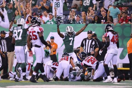 Aug 10, 2018; East Rutherford, NJ, USA; New York Jets wide receiver Tre McBride (7) signals touchdown by running back Isaiah Crowell (20) against the Atlanta Falcons during the first half at MetLife Stadium. Mandatory Credit: Vincent Carchietta-USA TODAY Sports