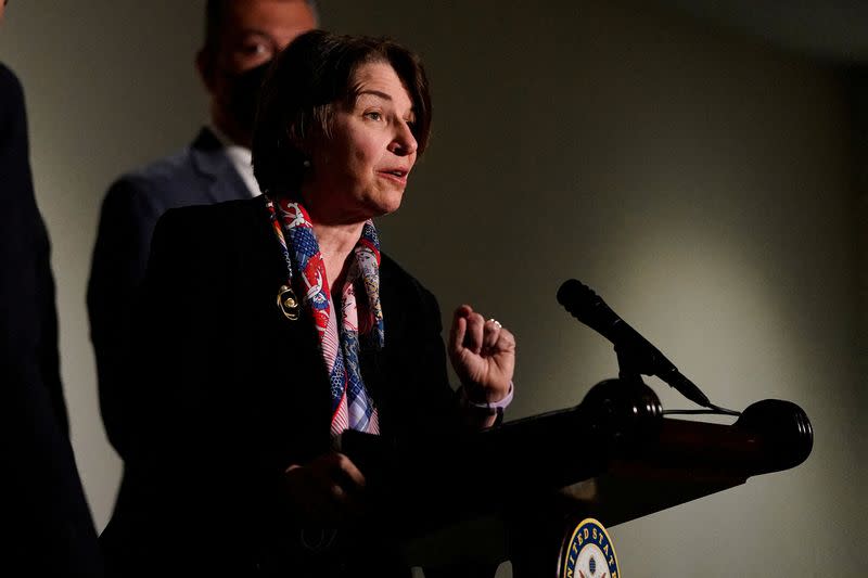 FILE PHOTO: U.S. Senator Amy Klobuchar (D-MN) speaks to reporters after a Senate Democrats caucus meeting on Capitol Hill in Washington