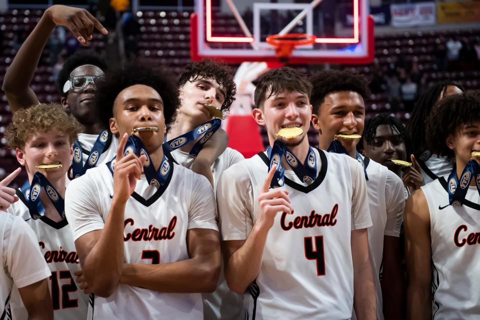 Central York players mug with their gold medals after winning the PIAA Class 6A Boys Basketball Championship against Parkland at the Giant Center on March 23, 2024, in Hershey. The Panthers won, 53-51, to capture their first title in program history.