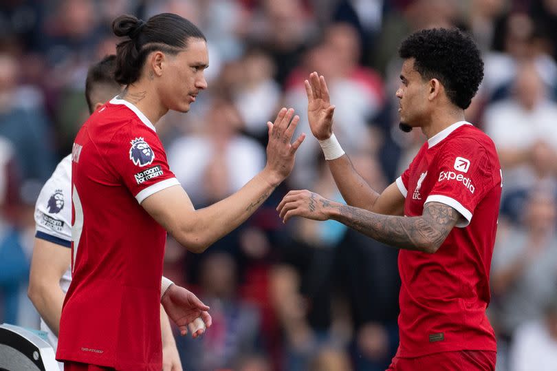 Darwin Núñez high-fives Luis Díaz as he comes on as a substitute for the Colombian during Liverpool's win over Tottenham