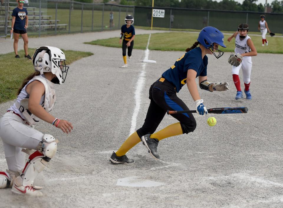 Molly Vida of Whiteford laid down a bunt. Bedford third baseman Lilly Vidra pounced on the ball and threw back to third base for an out in the 2023 Monroe County Fair Tournament Tuesday, July 9, 2023.