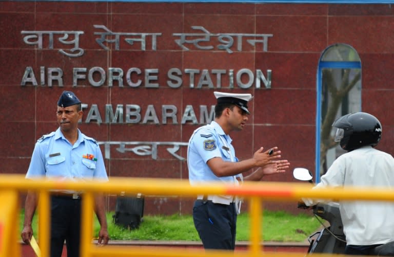 Indian Air Force personel stand guard outside Tambaram Airforce station in Chennai on July 23, 2016 as a massive search and rescue operation was underway for an Indian Air Force plane that went missing with 29 people on board over the Bay of Bengal