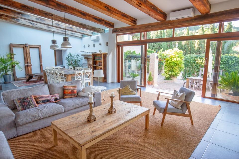 spacious living room with wood rafter ceilings