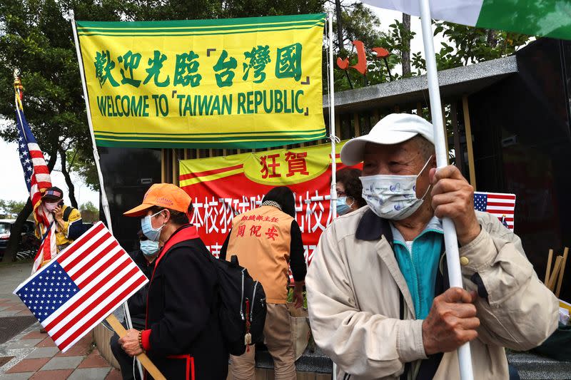 People from pro-Taiwan independent group gather around the airport to welcome the former U.S. senior officials arriving in Taipei