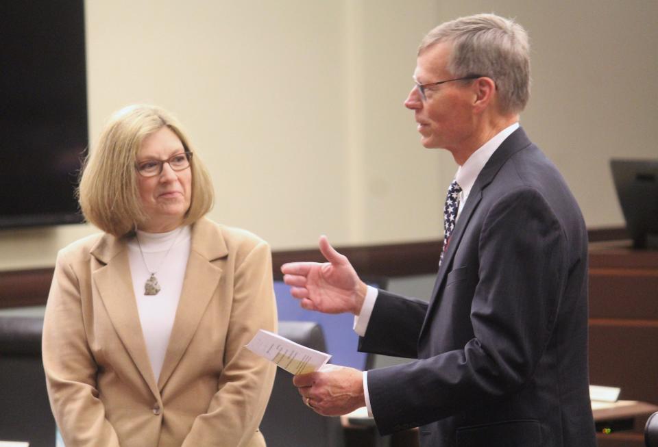 State Rep. Bradley Slagh prepares to give the oath of office to Cheryl Clark, the next Ottawa County Treasurer, on Friday, Dec. 29.