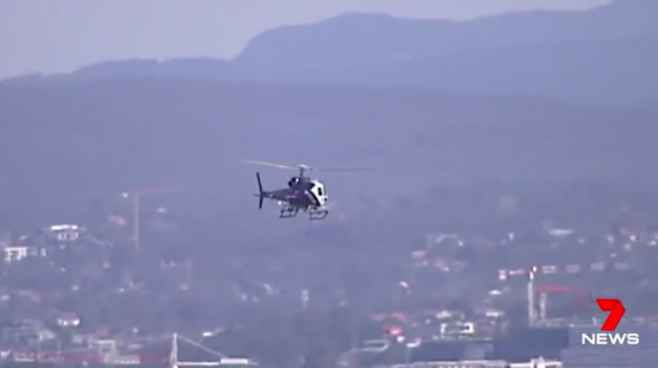 An air and ground search is underway for a man and woman seen fleeing the scene. Source: 7 News