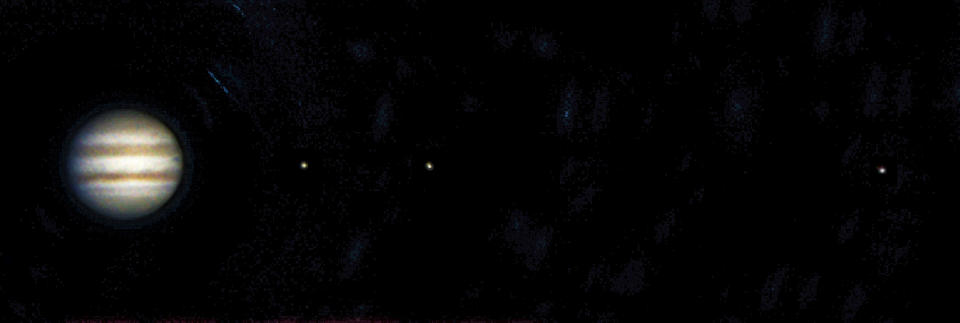 This image was captured on 28th october 2002 using a digital camera attached to an 8 inch Schmidt-Cassegrain telescope. Three of the planet's moons can be seen here. From left to right they are Europa, and Ganymede. This image closely resembles the view through a small telescope. (Photo by Jamie Cooper/SSPL/Getty Images)