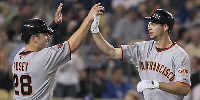 Brandon Belt (right) and Buster Posey give the Giants a bright future