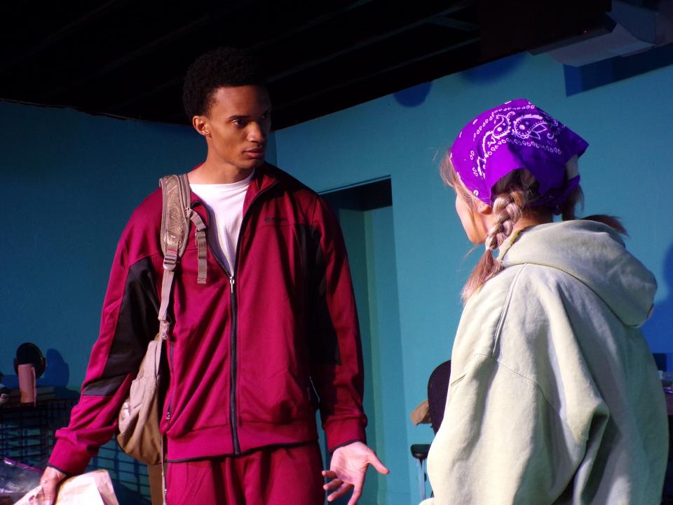 Jake Moon addresses Maya Anabella in a rehearsal scene for "I and You," the season-opening play at Iron Horse Community Theatre in Ambridge.