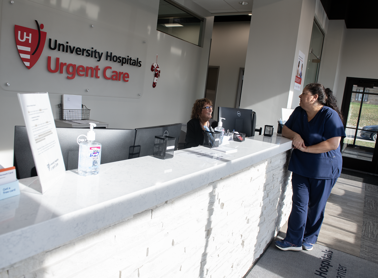 Teresa Neff, practice manager for UH Urgent Care in Kent , talks with Darla Remus, patient service representative, in the lobby of the new facility at 1005 E. Main St. in Kent.