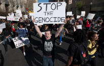 <p>Ian Jameson shouts as Black Lives Matter protesters march through the streets in response to the police shooting of Stephon Clark in Sacramento, Calif., on March 28, 2018. (Photo: Josh Edelson/AFP/Getty Images) </p>