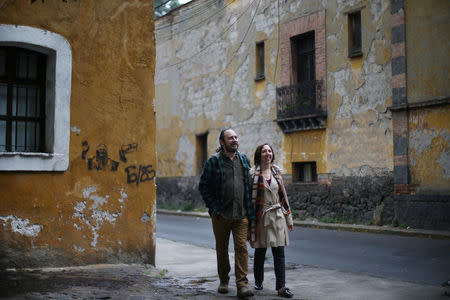 Alejandra, 44, an education policy consultant and Razhy, 48, a journalist and a human rights activist, walk on a street in the Coyoacan neighbourhood, in Mexico City, Mexico, February 9, 2018. The couple met in Mexico City in 1998, after Razhy was kidnapped and quit his job as a director of a weekly magazine in Oaxaca, a state south of the country. Months later, Alejandra traveled to Europe to study. "I went to study in France, I returned to the country and all went cold, my family did not accept our relationship. Finally, four years later, we were both without partners and decided to meet again. We got married in the neighbourhood of Coyoacan, the neighbourhood where we walked together and we met again after all those years," said Alejandra. During the earthquake on September 19, the apartment of the couple suffered considerable damage. "Our house was damaged by the earthquake, now we live in another apartment and are waiting for the legal liability to repair the damages and be able to return," said Razhy. The couple have a nine-year-old son. REUTERS/Edgard Garrido