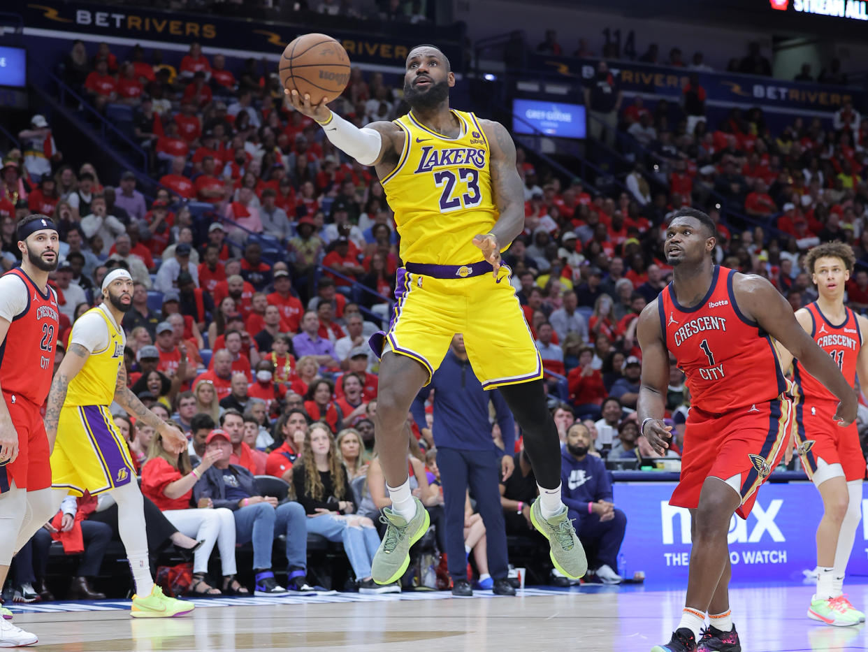 NEW ORLEANS, LOUISIANA - APRIL 16: LeBron James #23 of the Los Angeles Lakers drives to the basket as Zion Williamson #1 of the New Orleans Pelicans defends during a play-in tournament game at the Smoothie King Center on April 16, 2024 in New Orleans, Louisiana. NOTE TO USER: User expressly acknowledges and agrees that, by downloading and or using this Photograph, user is consenting to the terms and conditions of the Getty Images License Agreement. (Photo by Jonathan Bachman/Getty Images)