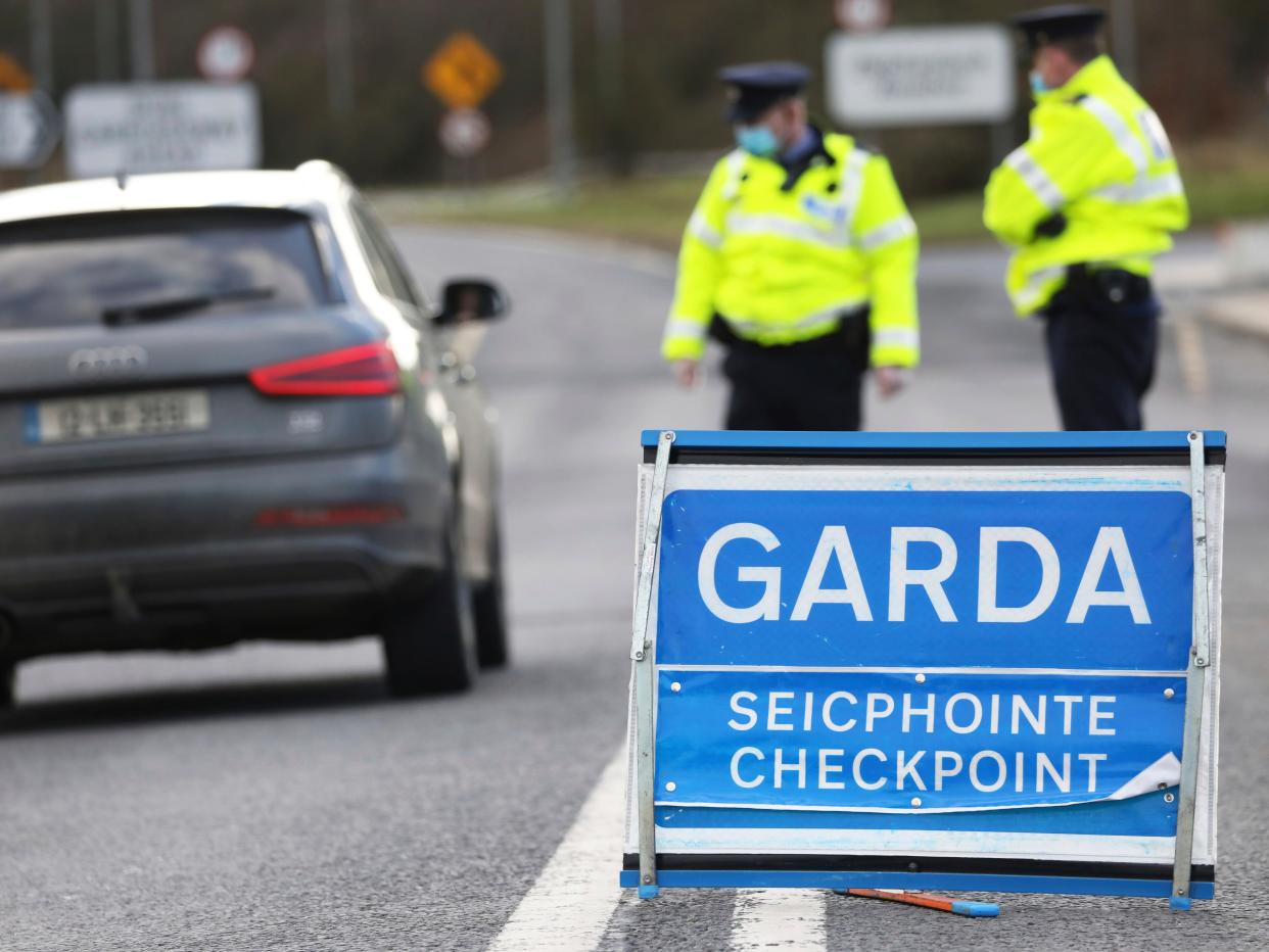 Garda Siochana (Irish Police), patrol a checkpoint close to the Irish border in Ravensdale, Ireland, Monday, Feb. 8, 2021. Checkpoints were set up across the country close to the border to stop people travelling from Northern Ireland into the Republic to enforce the new Covid-19 regulations.