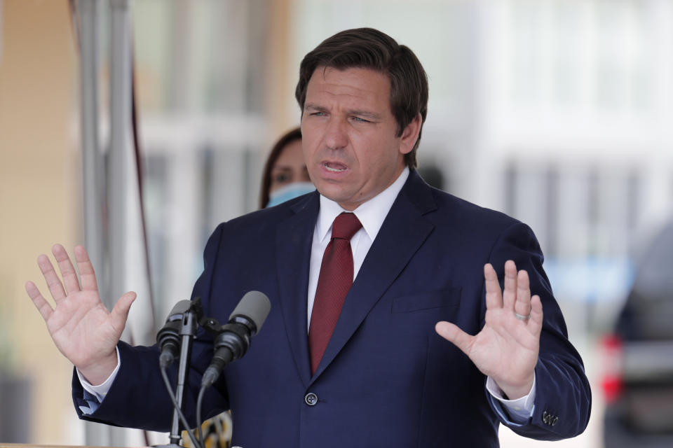 FILE - In this May 14, 2020, file photo, Florida Gov. Ron DeSantis speaks at a news conference in Doral, Fla. DeSantis is extending the state’s voter registration deadline that expired Monday, Oct. 5 until 7 p.m. EDT Tuesday, Oct. 6 after heavy traffic crashed the state’s online system and potentially prevented thousands of enrolling to cast ballots in next month’s presidential election. (AP Photo/Lynne Sladky, File)