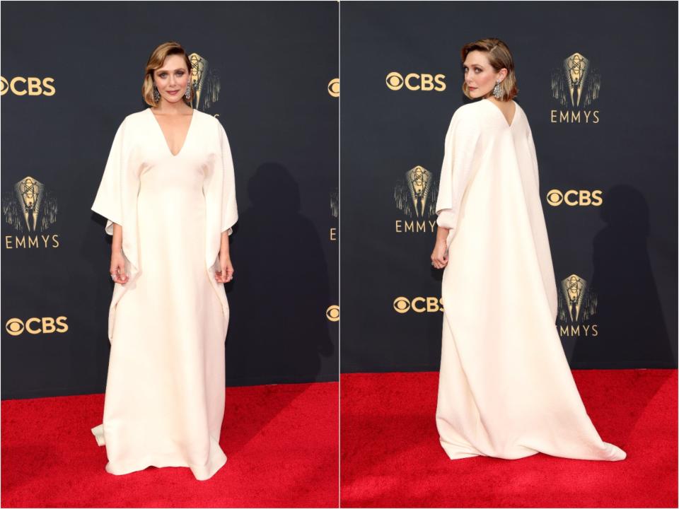 Elizabeth Olsen poses for pictures on the red carpet for the 2021 Emmy awards.