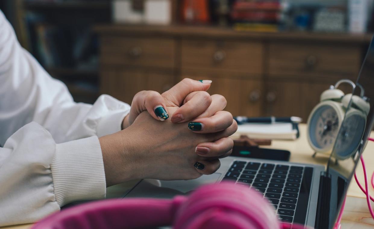 The Supreme Court may require employers to be more accommodating to religious requests in the workplace. <a href="https://www.gettyimages.com/detail/photo/midsection-of-woman-using-laptop-at-home-royalty-free-image/1350046560?phrase=prayer%20workplace" rel="nofollow noopener" target="_blank" data-ylk="slk:Victor Plop/500px via Getty Images;elm:context_link;itc:0;sec:content-canvas" class="link ">Victor Plop/500px via Getty Images</a>