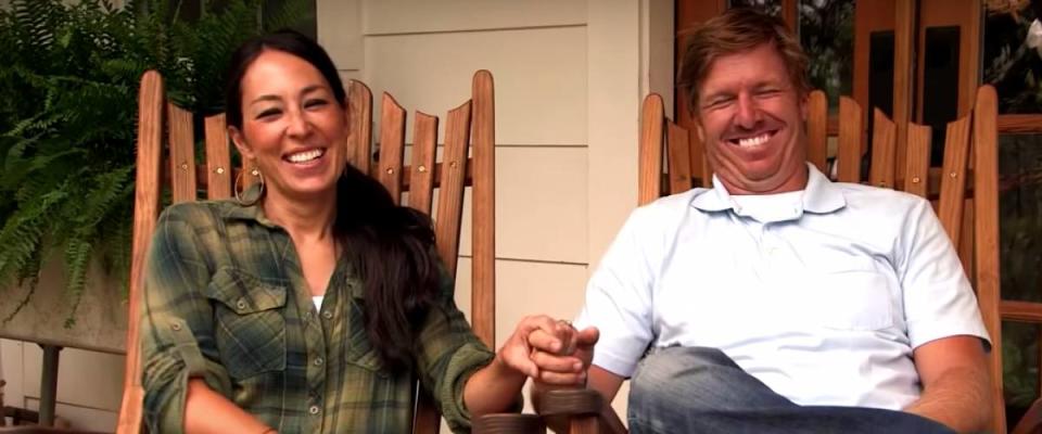 Chip and Joanna Gaines smile in rocking chairs.