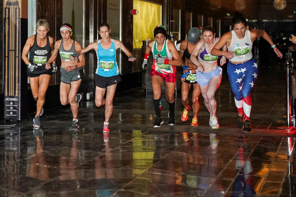 Runners race up the 86 flights, 1,576 stairs of the Empire State Building in the 