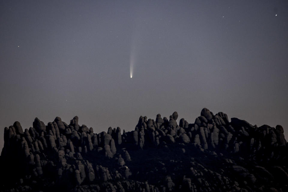 Neowise is seen above the mountain of Montserrat, near Barcelona, Catalonia, Spain, on July 9, 2020. / Credit: Albert Llop/NurPhoto via Getty Images