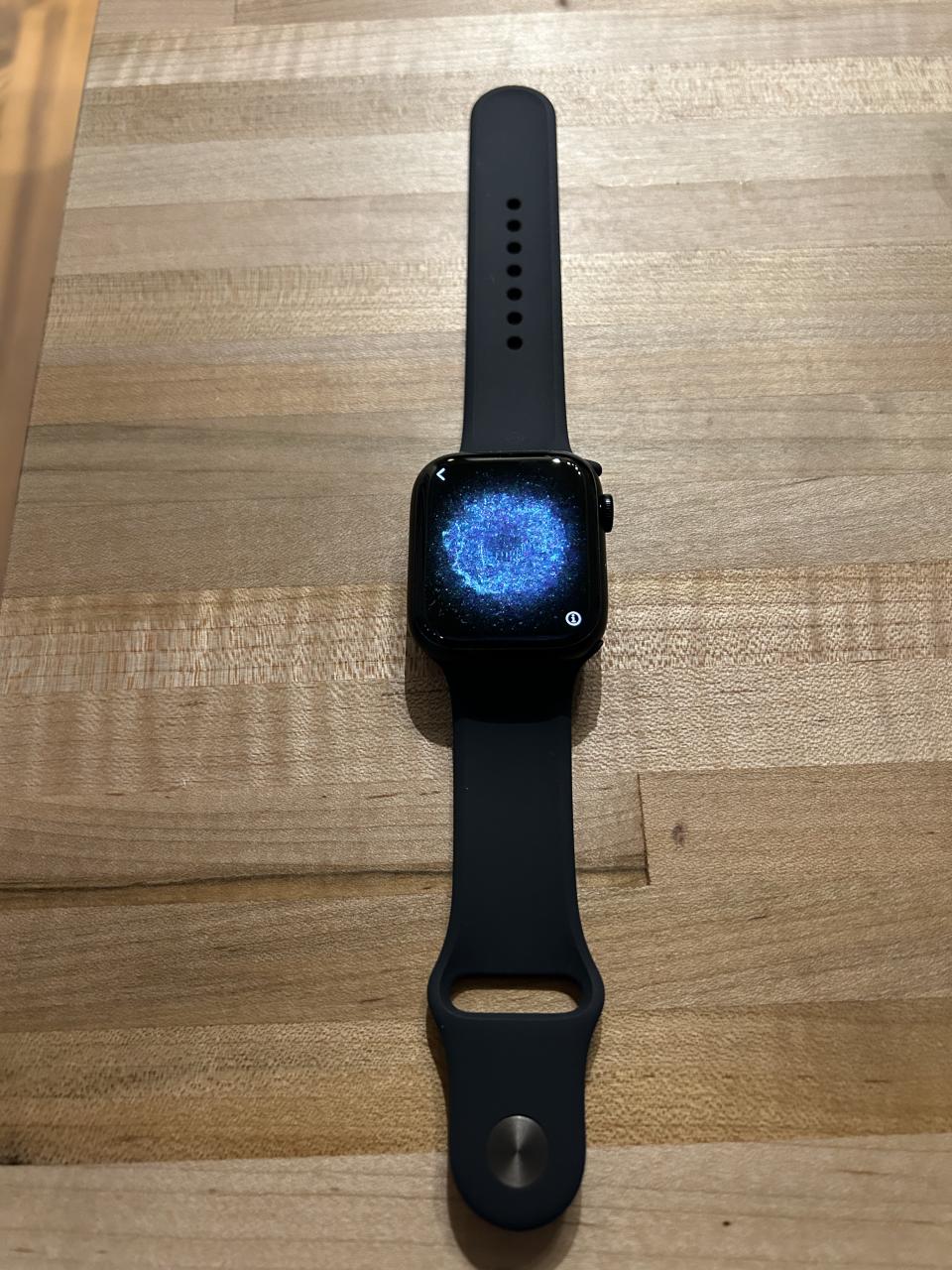 apple watch series 8 with black strap and black and blue screen