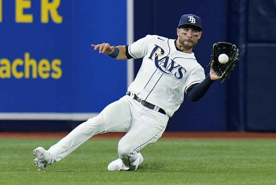 Tampa Bay Rays center fielder Kevin Kiermaier (39) makes a sliding catch on a fly out by Baltimore Orioles' Anthony Santander during the third inning of a baseball game Friday, June 11, 2021, in St. Petersburg, Fla. (AP Photo/Chris O'Meara)