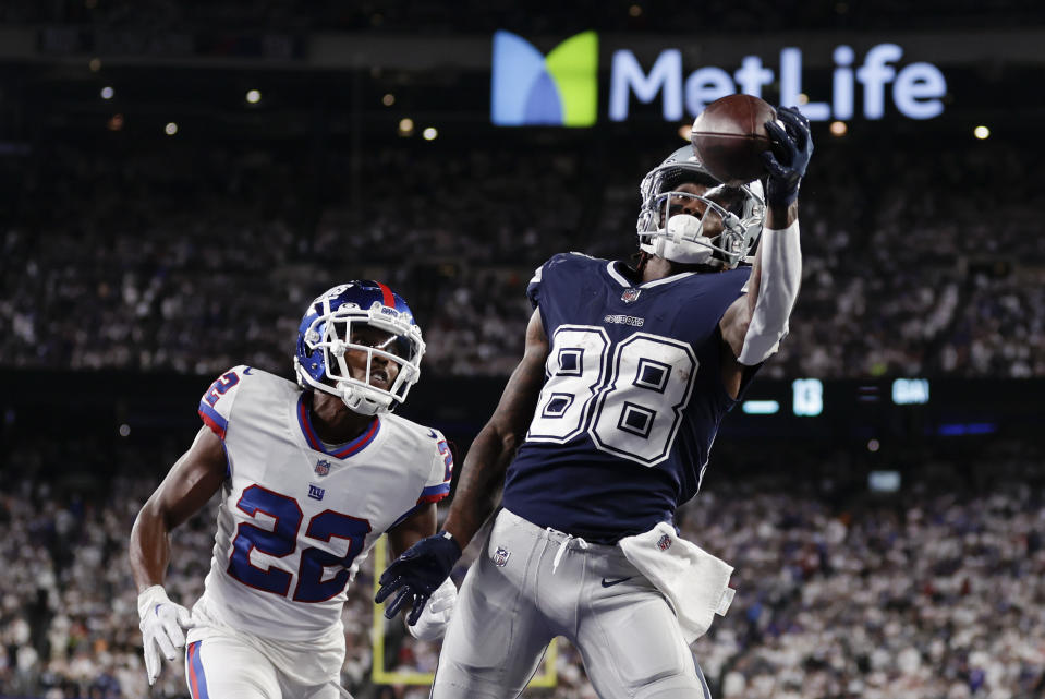 Dallas Cowboys wide receiver CeeDee Lamb (88) makes a catch in the end zone for a touchdown against New York Giants cornerback Adoree' Jackson (22) during the fourth quarter of an NFL football game, Monday, Sept. 26, 2022, in East Rutherford, N.J. (AP Photo/Adam Hunger)