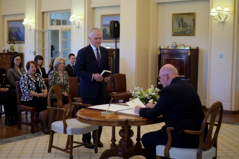 Malcolm Turnbull (L) is sworn in by Australia's Governor-General Sir Peter Cosgrove as Australia's 29th Prime Minister at Government House in Canberra on September 15, 2015