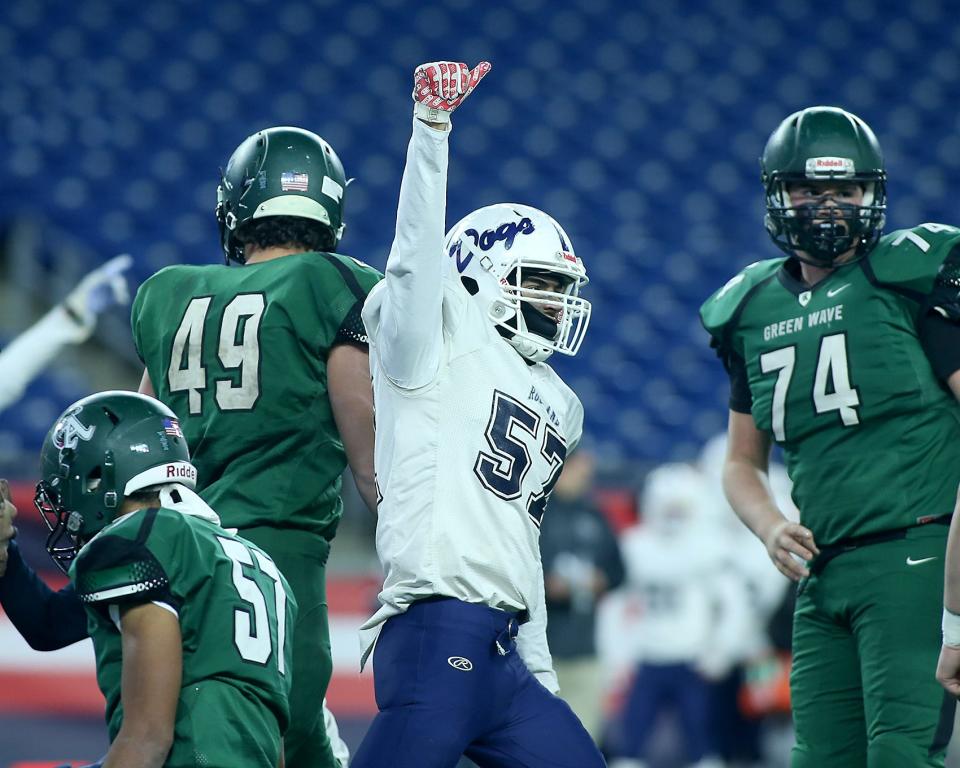 Rockland’s Gabe Pinheiro celebrates his defense's fourth-down stop of Abington to turn the ball over on downs in the second quarter of the Division 6 state title game at Gillette Stadium in Foxboro on Friday, Dec. 3, 2021.