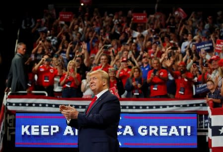 U.S. President Donald Trump reacts on stage formally kicking off his re-election bid with a campaign rally in Orlando