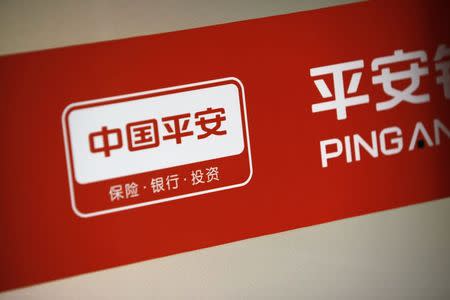 The logo of China's Ping An Insurance is seen at its branch in Shanghai in this December 6, 2012 file picture. A Chinese retailer is offering insurance to customers who buy infant milk powder, highlighting the lengths to which companies are going to address concern about food safety in China. REUTERS/Aly Song/Files
