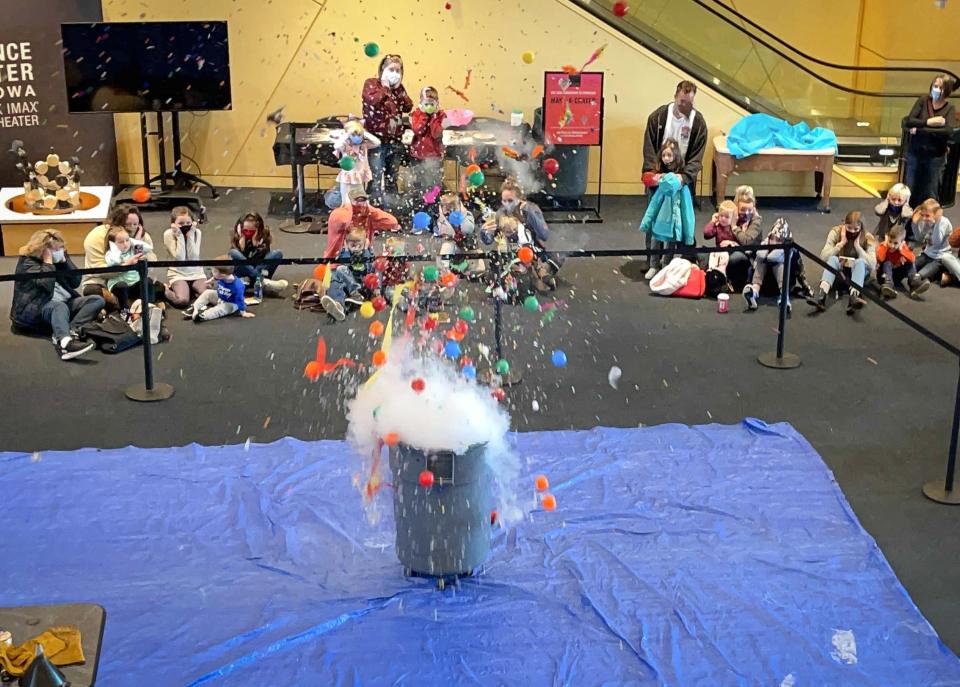 More than 100 children gathered at the Science Center of Iowa to send 2020 out with a bang on Thursday, Dec. 31, with the Countdown to Extinction exhibit, which featured an asteroid that exploded with a thunderous boom and other dinosaur-themed activities. 