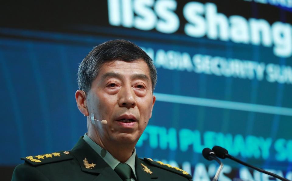 General Li Shangfu delivers a speech at the International Institute for Strategic Studies Shangri-la Dialogue in Singapore - Shutterstock