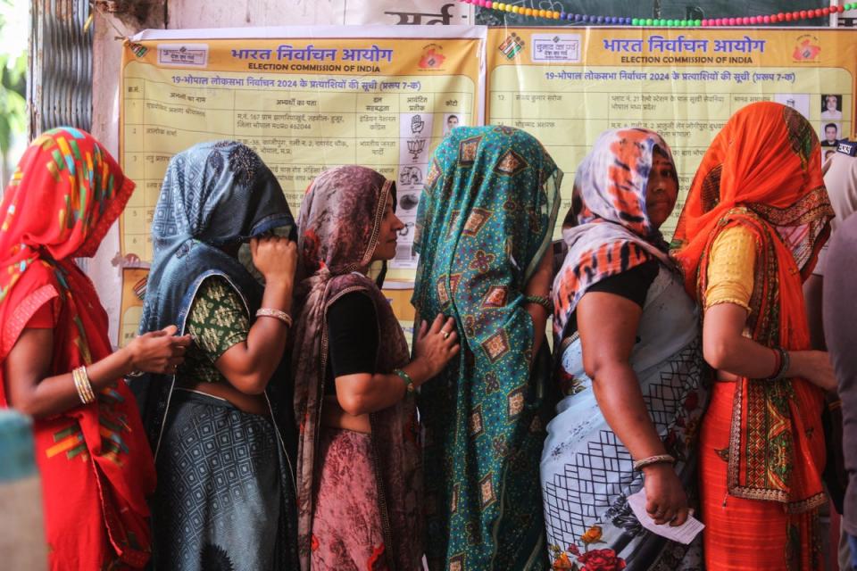 Indians stand in a queue to cast their ballots at a polling station during the third phase of polling in India's general election in Bhopal (AFP via Getty)
