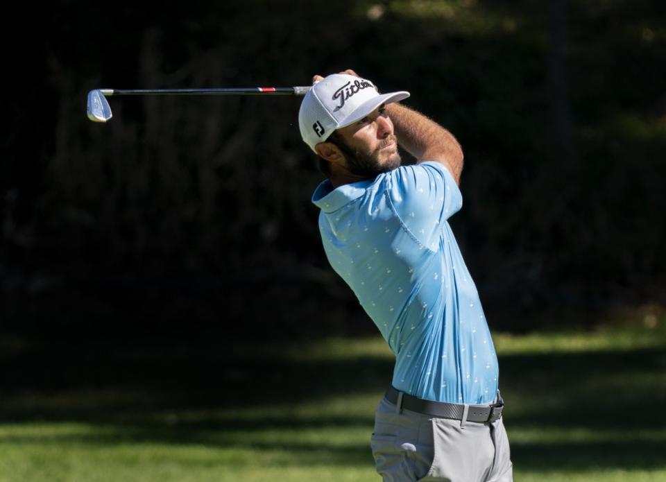 Max Homa watches his approach shot to the 12th green during the final round of the Genesis Invitational.