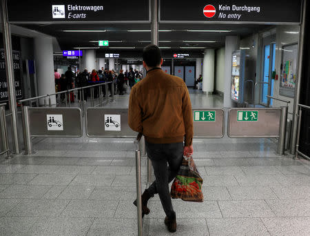 A man waits outside a security screening area at Germany's largest airport, Fraport, in Frankfurt, Germany, January 14, 2019. REUTERS/Kai Pfaffenbach