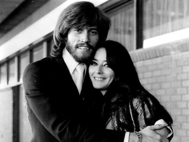 <p>Trevor James Robert Dallen/Fairfax Media/Getty </p> Barry Gibb embracing his wife Linda in July 1971